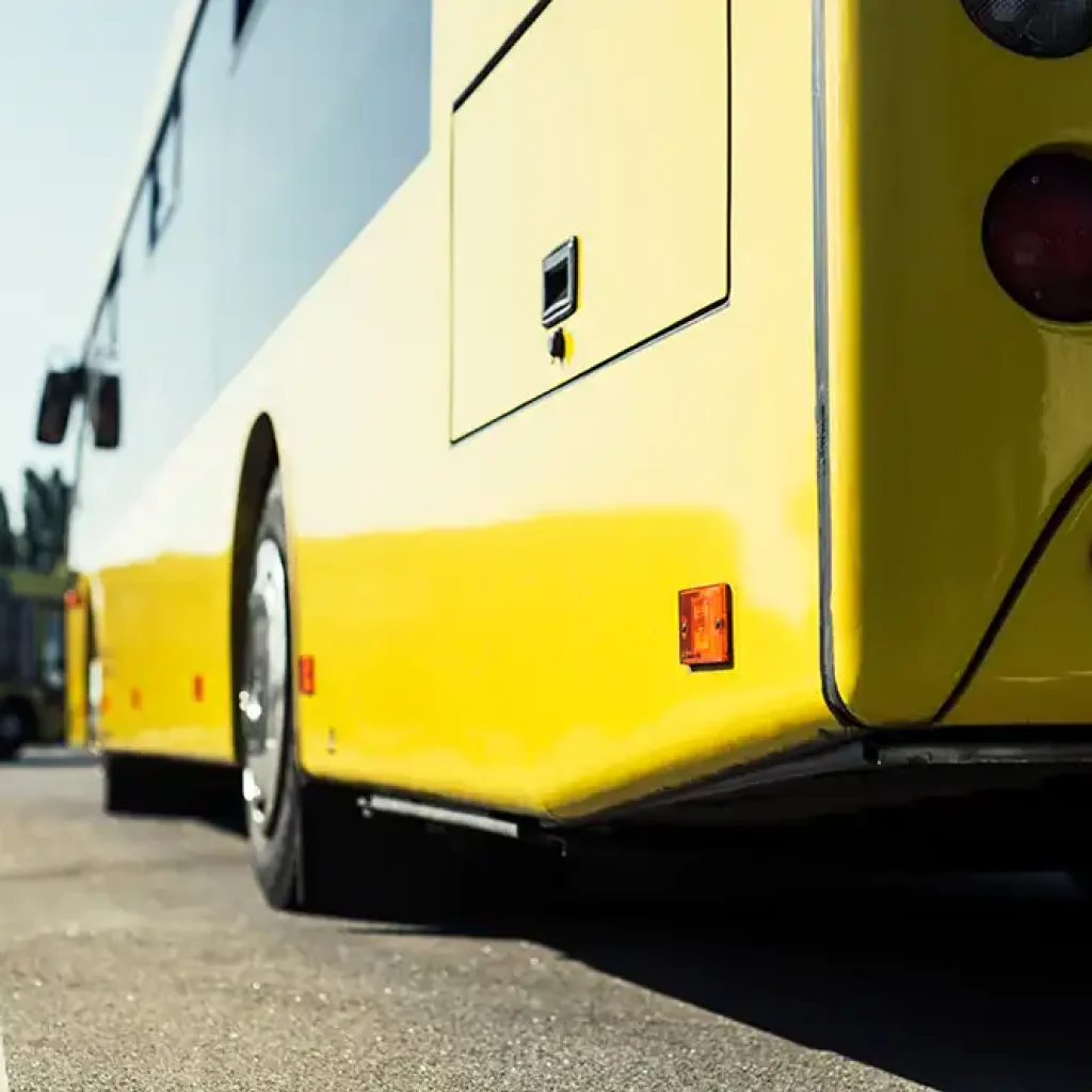 Yellow bus parked on roadside. Yellow bus parked on roadside.
